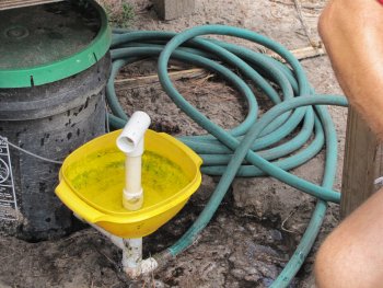 hose is hooked up to the chicken mobile drinking station